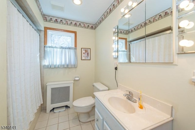 bathroom featuring curtained shower, baseboards, toilet, tile patterned floors, and vanity