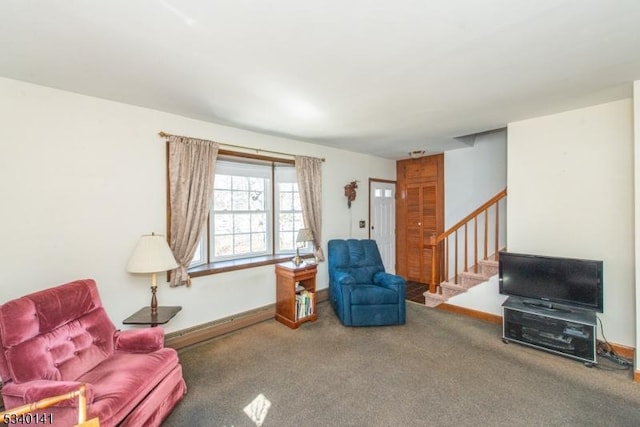 living area with a baseboard heating unit, stairs, baseboards, and carpet floors