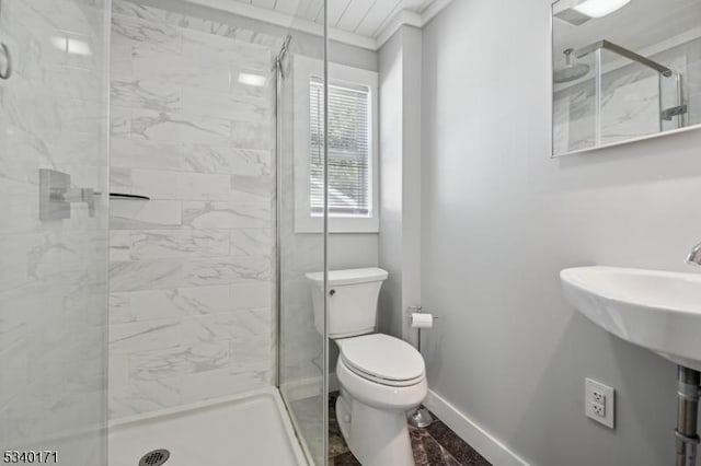 full bath featuring ornamental molding, a stall shower, baseboards, and toilet