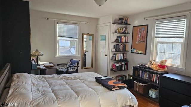 bedroom with wood finished floors