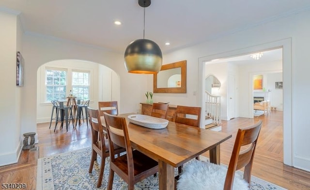 75 Crest Dr, South Orange Village Twp, NJ 07079 - dining area with arched walkways, crown molding, light wood finished floors, baseboards, and recessed lighting