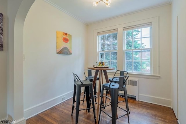 75 Crest Dr, South Orange Village Twp, NJ 07079 - dining space featuring arched walkways, crown molding, radiator, wood finished floors, and baseboards