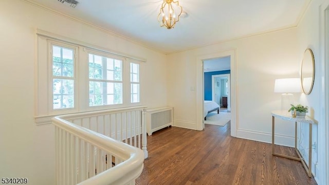 75 Crest Dr, South Orange Village Twp, NJ 07079 - hall featuring radiator, wood finished floors, baseboards, crown molding, and a chandelier