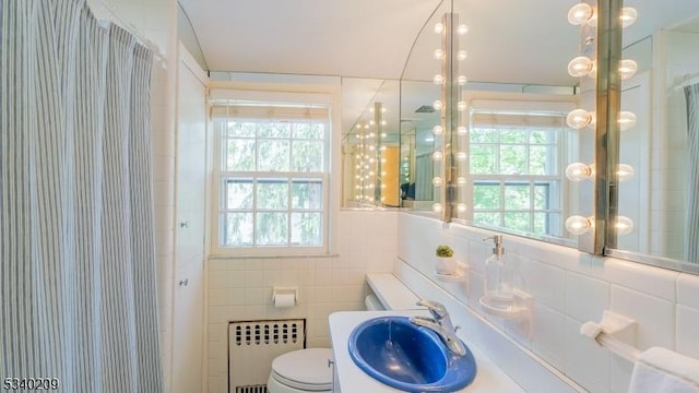 75 Crest Dr, South Orange Village Twp, NJ 07079 - bathroom with radiator, toilet, curtained shower, tile walls, and vanity
