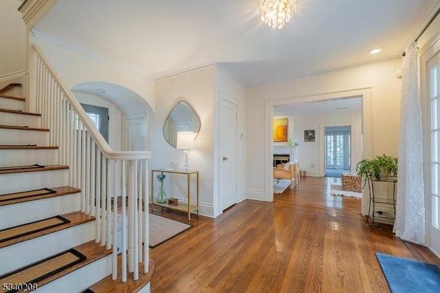 75 Crest Dr, South Orange Village Twp, NJ 07079 - foyer entrance featuring stairway, wood finished floors, crown molding, a fireplace, and baseboards