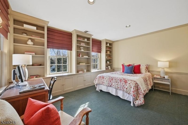 bedroom with crown molding, recessed lighting, dark carpet, and baseboards