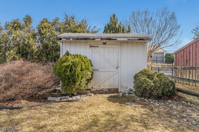 view of shed with fence