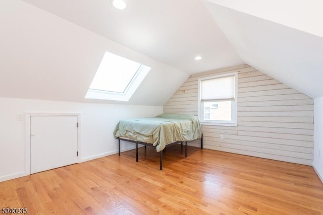 bonus room with recessed lighting, vaulted ceiling, light wood-style flooring, and baseboards