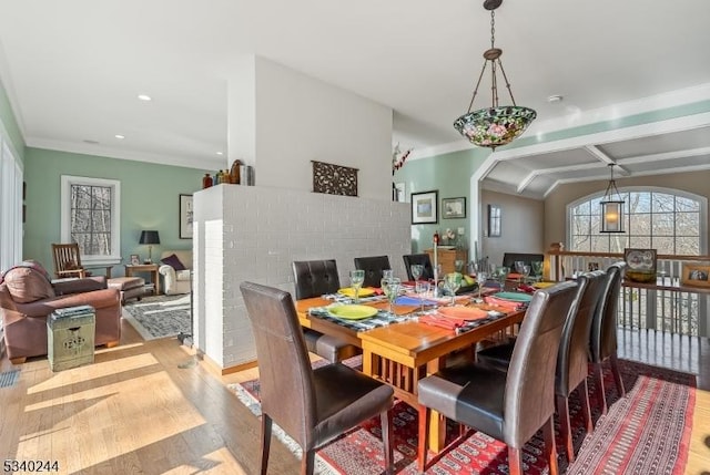 dining room featuring ornamental molding, wood finished floors, and recessed lighting