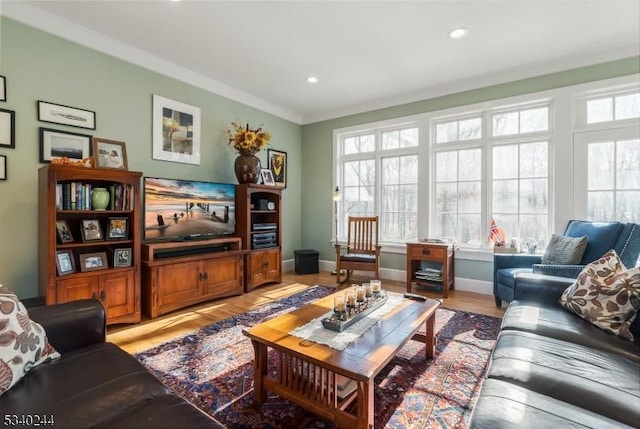 living room featuring light wood finished floors, baseboards, and recessed lighting