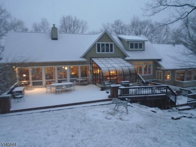 view of snow covered house