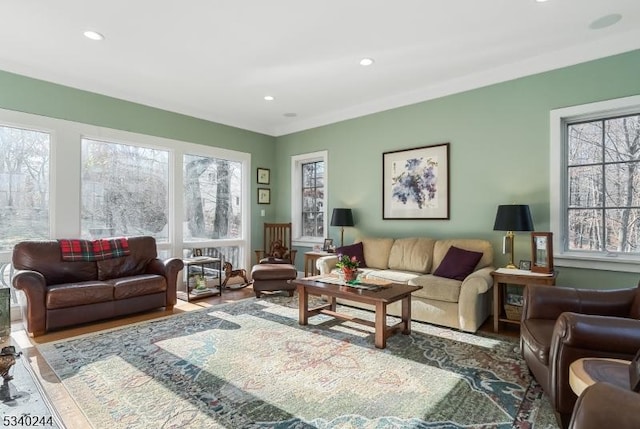 living room with wood finished floors and recessed lighting