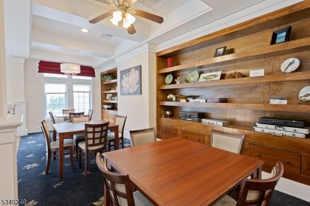 dining space featuring visible vents, built in features, beamed ceiling, dark colored carpet, and ceiling fan with notable chandelier