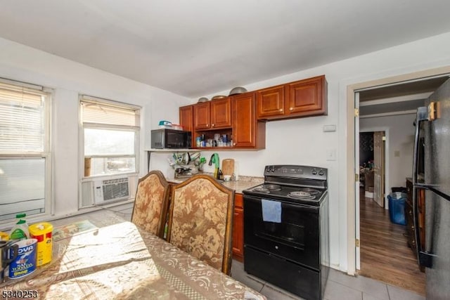 kitchen featuring light tile patterned flooring, cooling unit, open shelves, light countertops, and black appliances