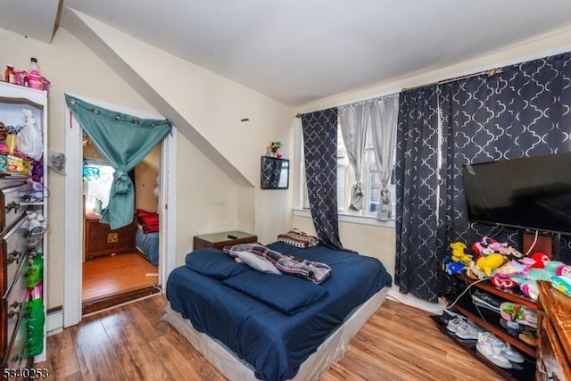 bedroom featuring wood finished floors