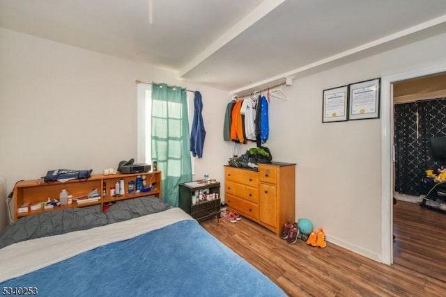 bedroom with wood finished floors