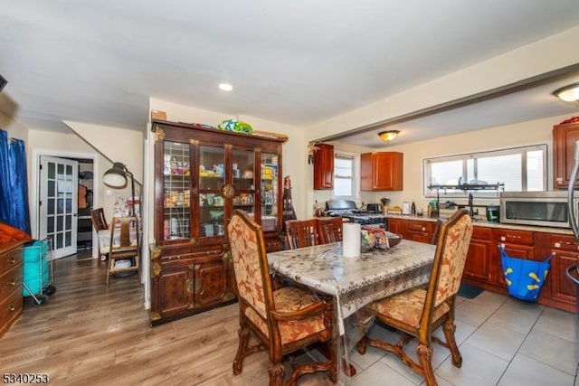 dining space with light wood-style flooring