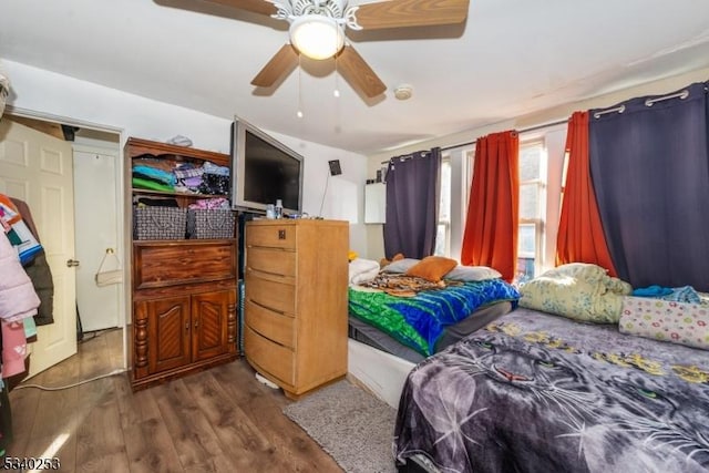 bedroom featuring ceiling fan and wood finished floors