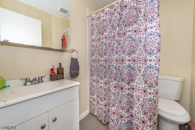 bathroom featuring visible vents, vanity, toilet, and tile patterned floors