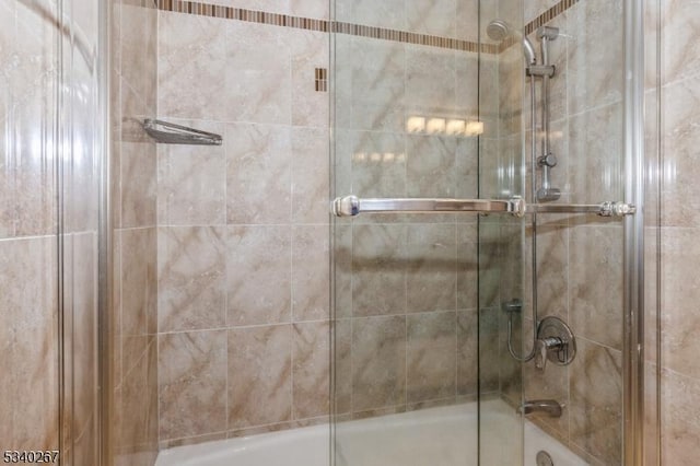 bathroom featuring enclosed tub / shower combo