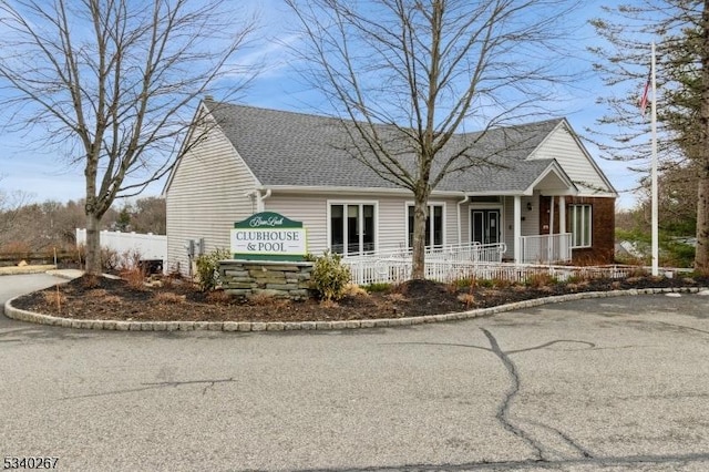 view of building exterior with fence