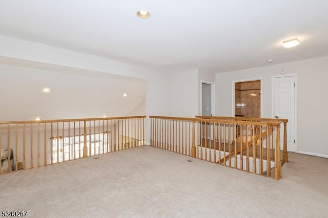 carpeted empty room featuring recessed lighting