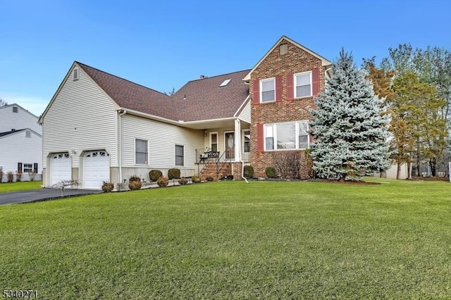 view of front of home with aphalt driveway, brick siding, roof with shingles, an attached garage, and a front lawn