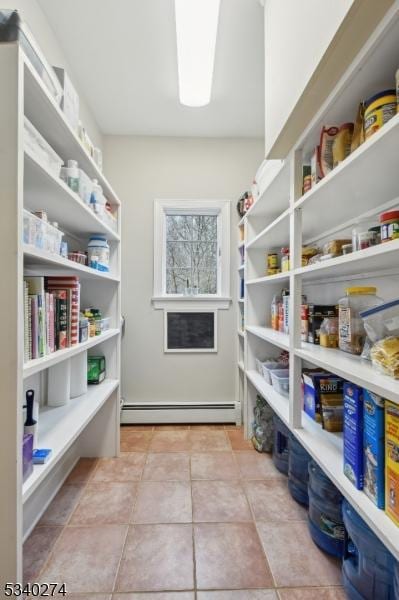 storage area featuring a baseboard radiator