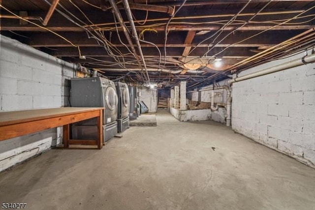 unfinished basement featuring independent washer and dryer