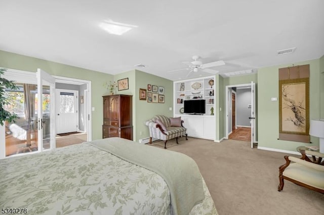 carpeted bedroom with baseboards, visible vents, and ceiling fan