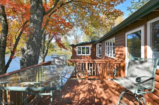 deck with outdoor dining area