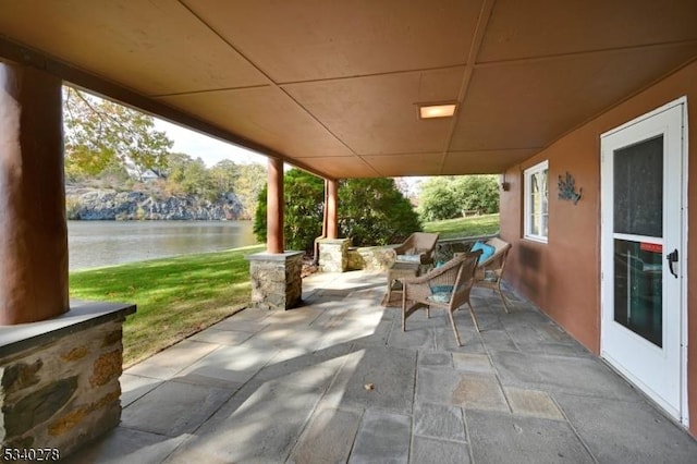 view of patio / terrace featuring a water view