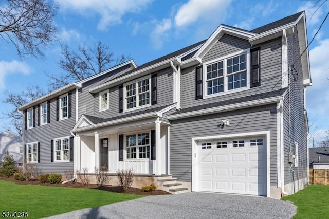 view of front facade featuring an attached garage and a front yard