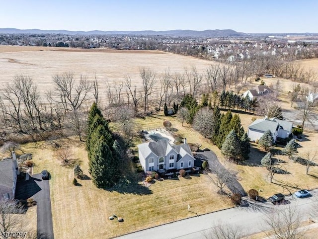 birds eye view of property featuring a rural view and a mountain view