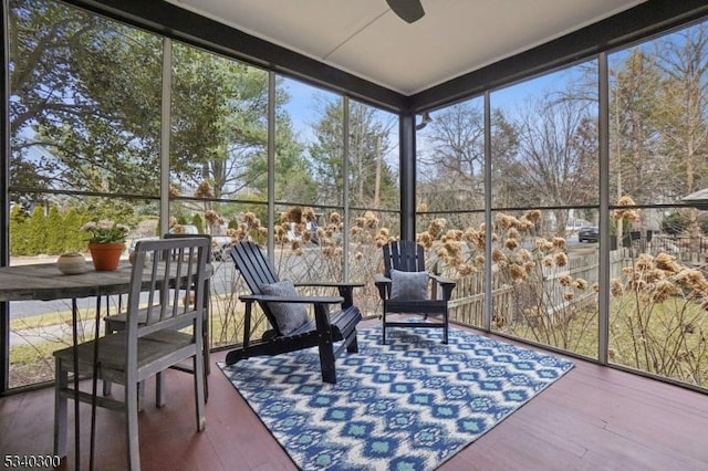 sunroom featuring plenty of natural light and ceiling fan