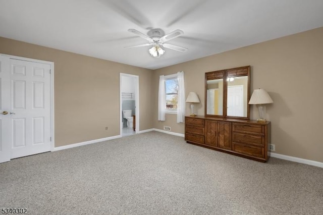 unfurnished bedroom featuring baseboards, carpet floors, visible vents, and ceiling fan