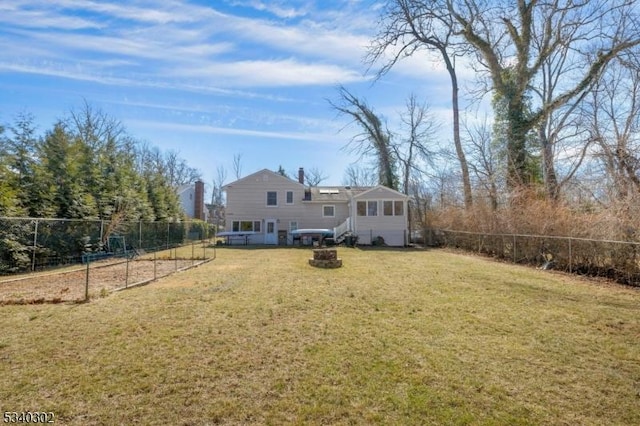 view of yard featuring a garden and a fenced backyard