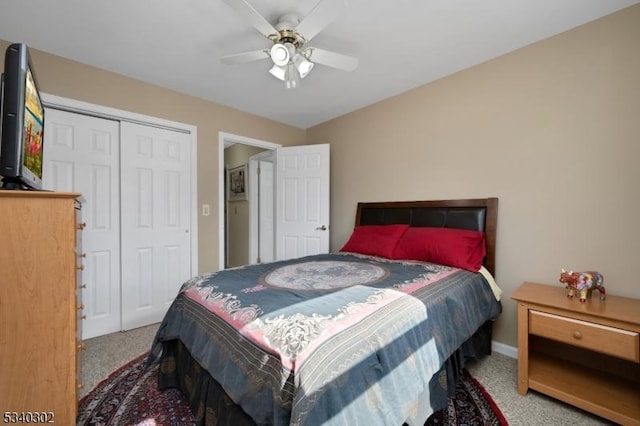 bedroom with carpet flooring, a ceiling fan, and a closet