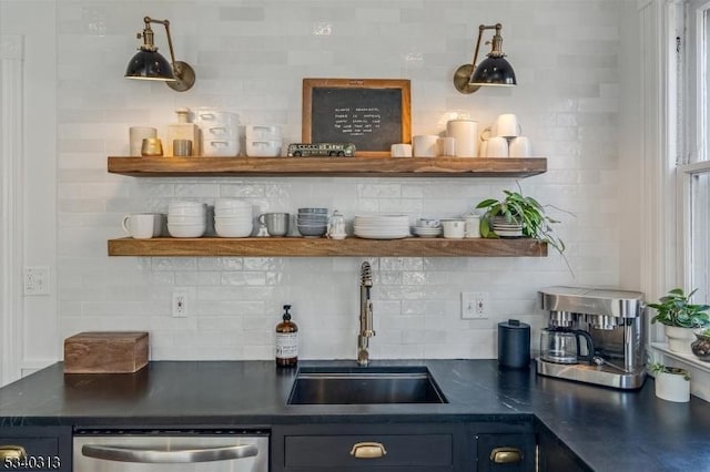 bar with decorative backsplash, dishwasher, and a sink