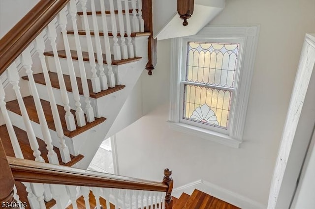 stairs featuring plenty of natural light and baseboards