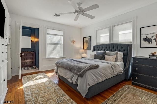 bedroom with visible vents, wood-type flooring, and ceiling fan