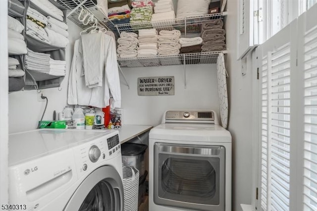 laundry area featuring laundry area and washing machine and clothes dryer