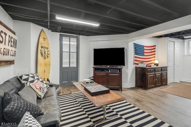 living area featuring plenty of natural light and light wood-style floors