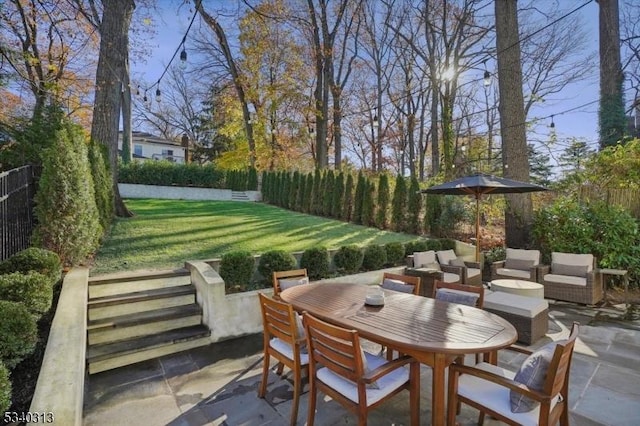 view of patio with an outdoor living space, outdoor dining space, and fence