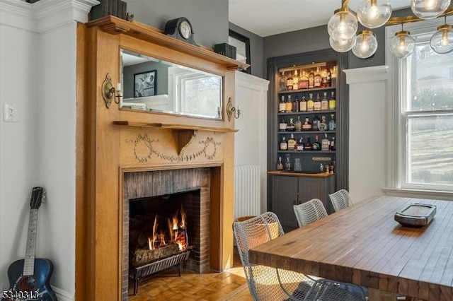 dining area with a brick fireplace