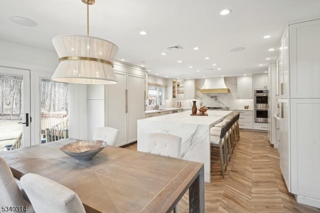 dining space featuring visible vents and recessed lighting