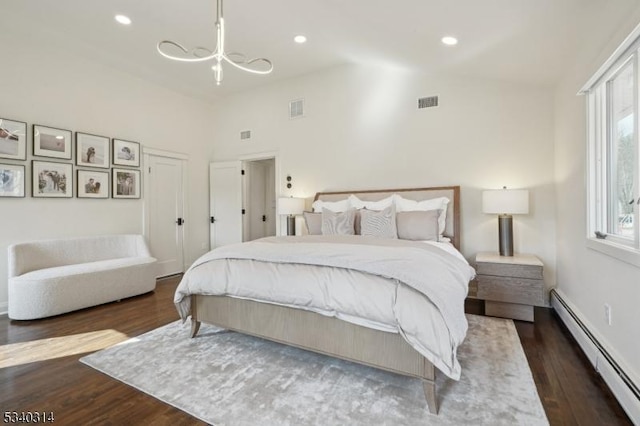 bedroom with dark wood-style floors, recessed lighting, visible vents, and baseboard heating