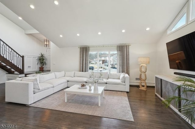 living room featuring high vaulted ceiling, recessed lighting, dark wood-style flooring, and stairs