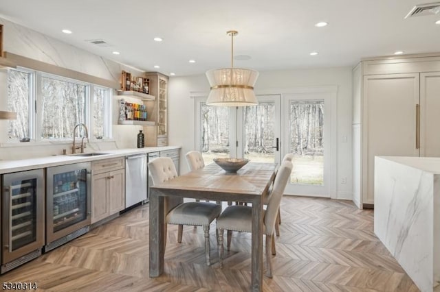 dining area with beverage cooler, visible vents, and recessed lighting