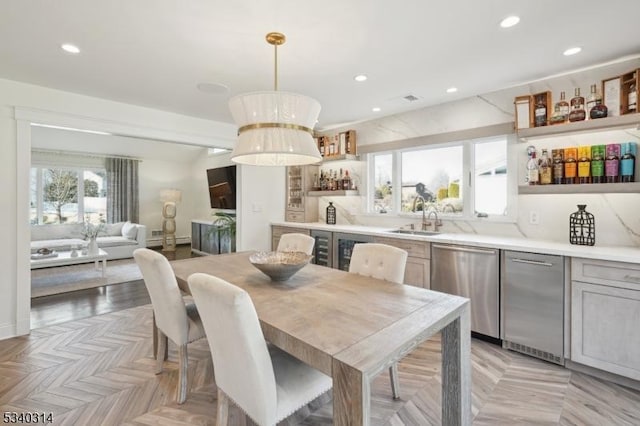 dining area with recessed lighting and indoor wet bar